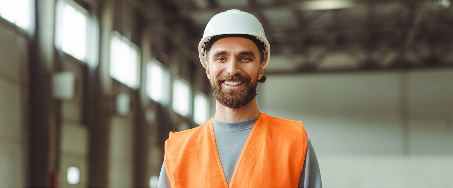 A man wearing a hard hat and a high vis vest